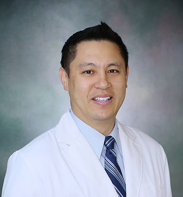 Dr. Hogan Shy, MD Dr. Hogan Shy, MD, smiling in a white coat, representing expertise in hair restoration and aesthetic treatments at EnVie Skin and Body.